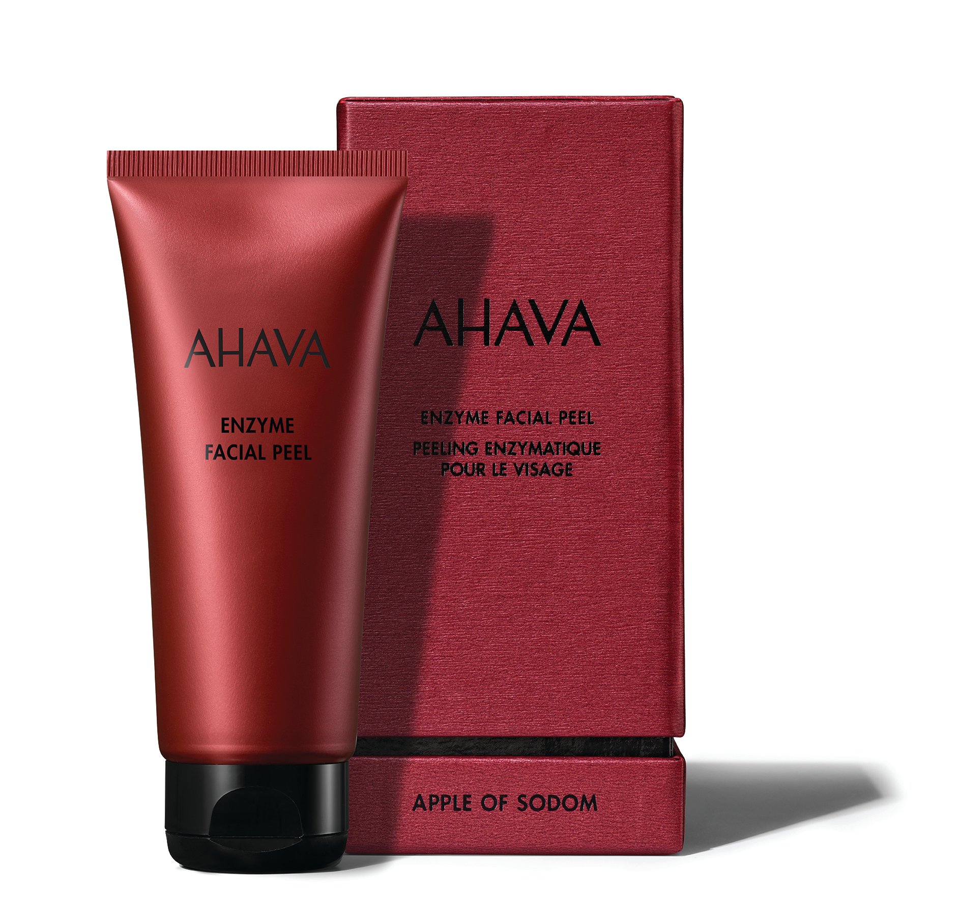 AHAVA Enzyme Facial Peel in roter Tube vor passender Verpackung, Produktname und Beschreibung auf Englisch und Französisch.