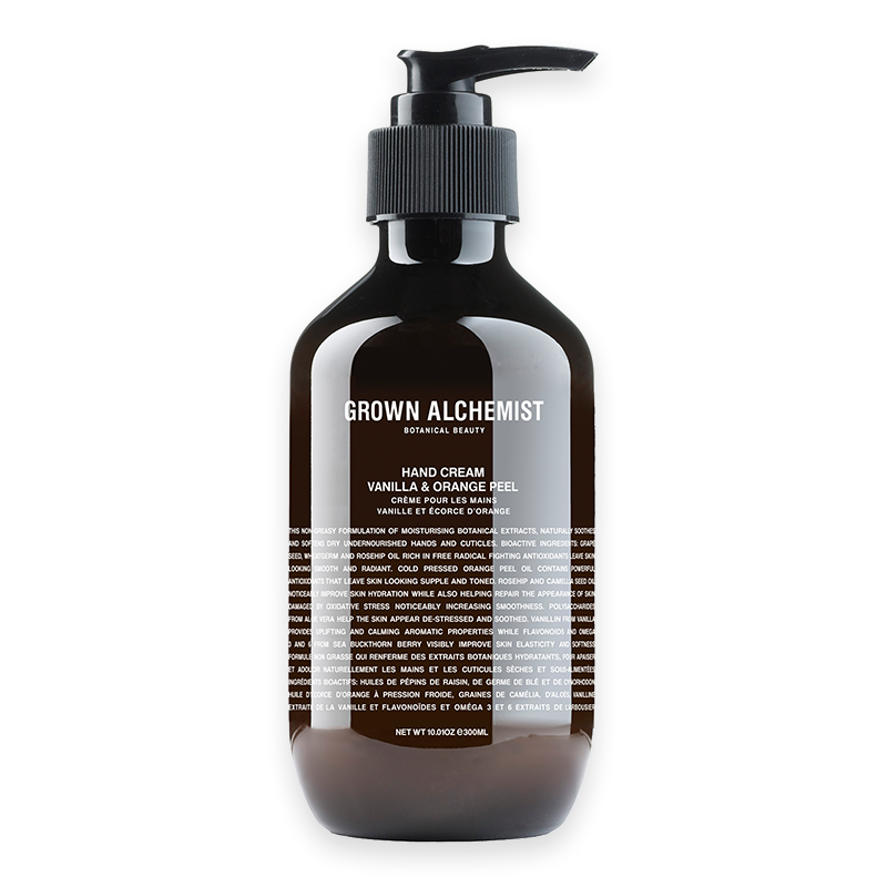 Handcreme 'Vanilla & Orange Peel' von Grown Alchemist, 300 ml, in einer braunen Flasche mit Pumpspender.