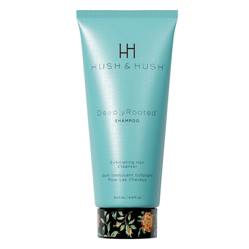 HUSH & HUSH DeeplyRooted Shampoo, 200 ml, exfolierendes Haarreinigungsmittel in türkisfarbener Tube mit floralem Design am Boden.